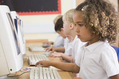 elementary students working in a computer lab elementary students working in a computer lab